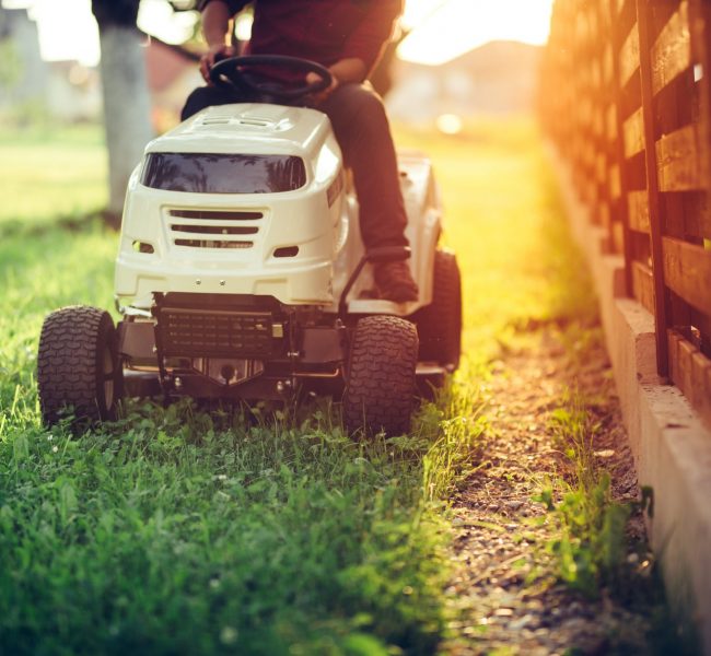 Close,Up,Details,Of,Landscaping,And,Gardening.,Worker,Riding,Industrial